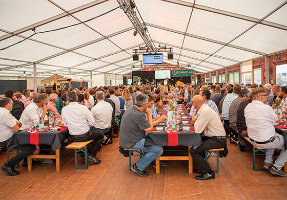 Rommelag employees at dining tables at an event